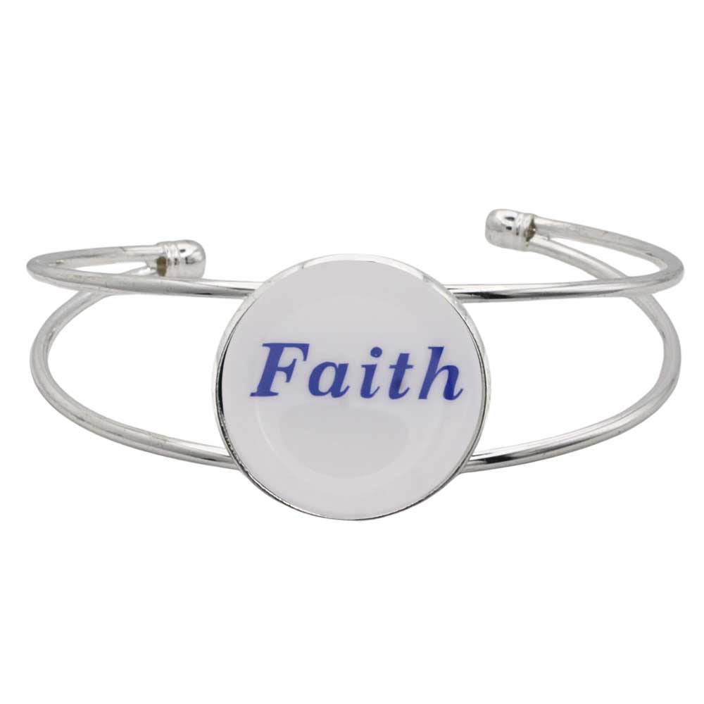 A silver-toned metal cuff bracelet featuring a round white disc with the word “Faith” printed in blue script, shown on a plain white background – Lilylin Designs