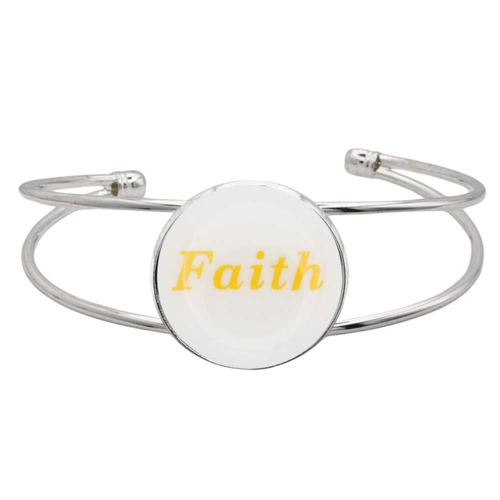 A silver-toned metal cuff bracelet featuring a round white disc with the word “Faith” printed in yellow script, shown on a plain white background – Lilylin Designs
