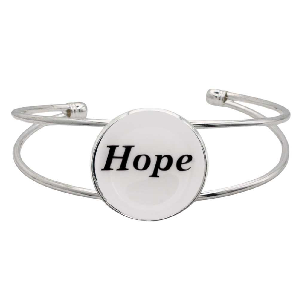 A silver-toned metal cuff bracelet featuring a round white disc with the word “Hope” printed in black script, shown on a plain white background – Lilylin Designs
