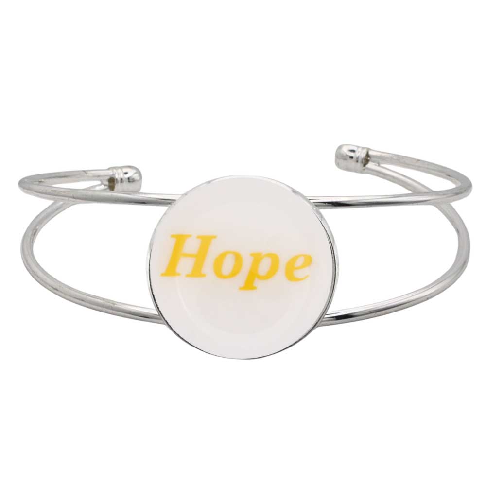 A silver-toned metal cuff bracelet featuring a round white disc with the word “Hope” printed in yellow script, shown on a plain white background – Lilylin Designs