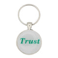 Round white disc with Trust in green keychain and bag charm - Lilylin Designs
