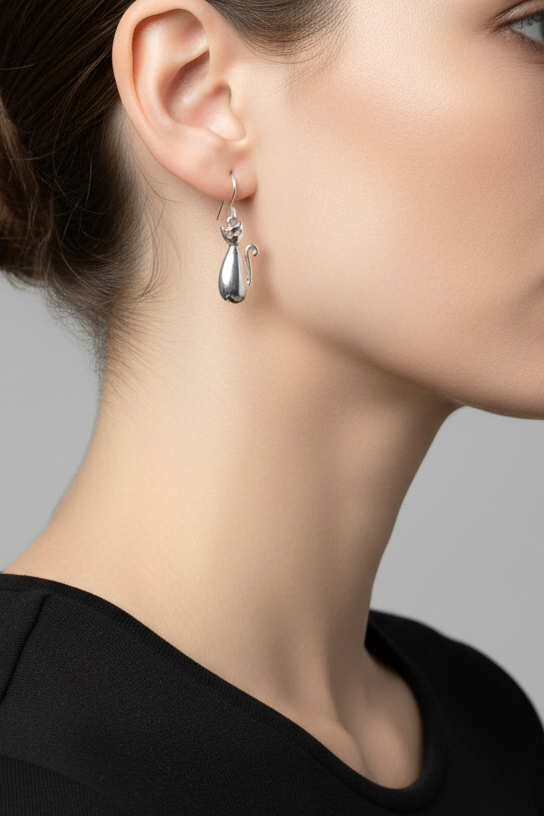 Model wearing silver-tone cat dangle earring - Lilylin Designs