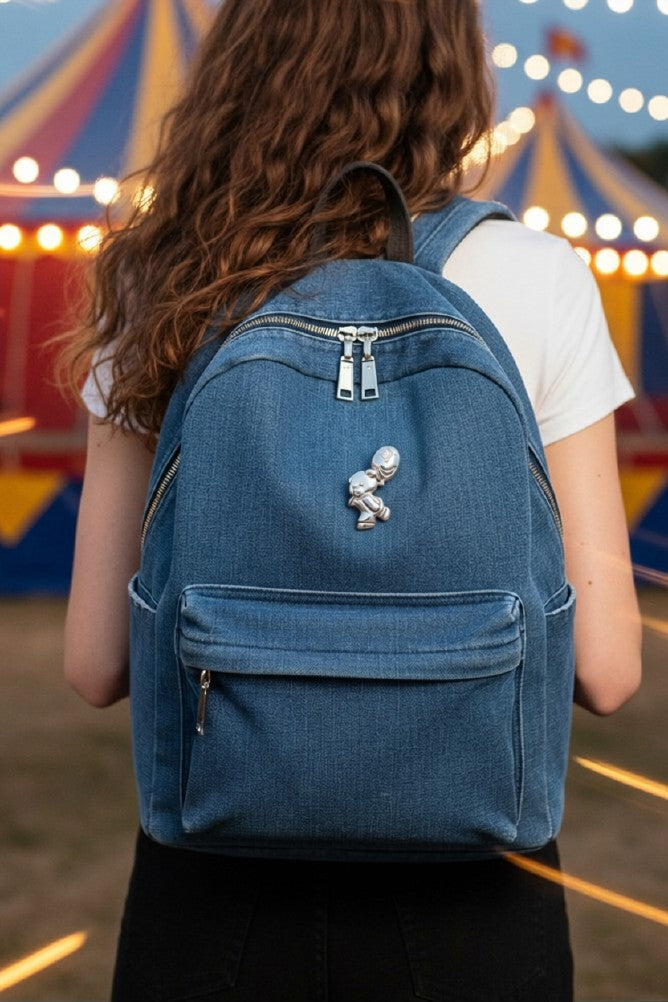 Teddy bear with balloon on denim backpack worn by a girl at a circus - Lilylin Designs