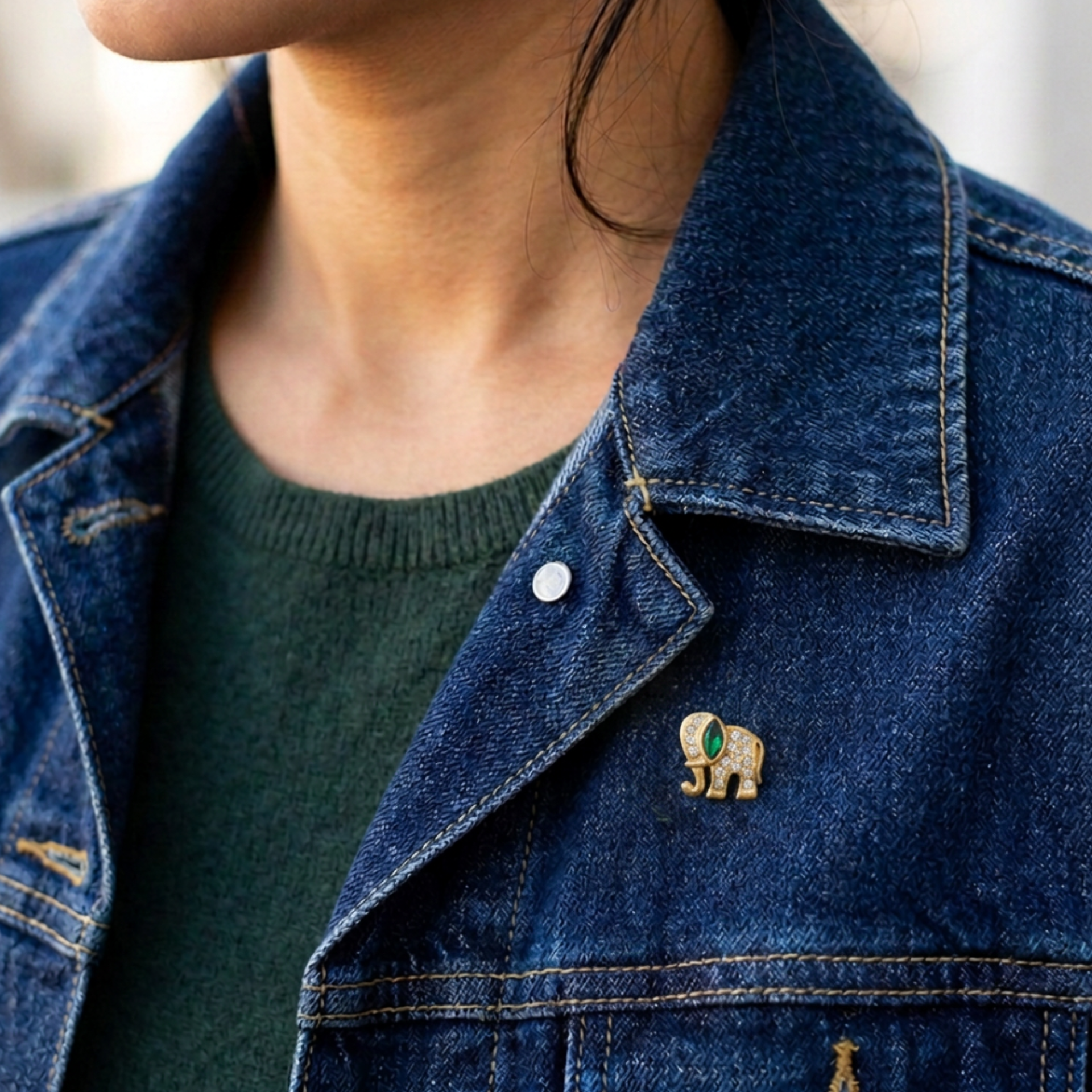 Tiny Crystal Elephant Lapel Tac Pin on model wearing a denim jacket and green top - Lilylin Designs