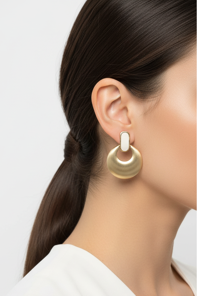 Model wearing brushed gold with white enamel doorknocker clip earring - Lilylin Designs