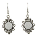 Silver earrings with decorative frames and white central stones on a white background - Lilylin Designs