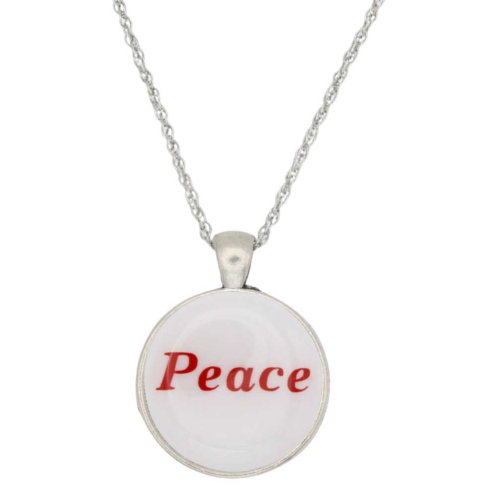 A silver chain necklace with a round pendant featuring a white face with the word 'Peace' printed in red, set against a plain white background - Lilylin Designs