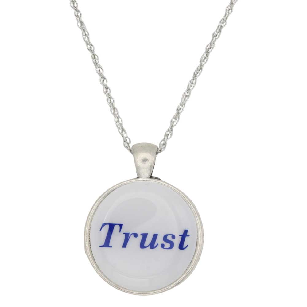 A silver chain necklace with a round pendant featuring the word 'Trust' in blue script on a white background, shown against a plain white backdrop - Lilylin Designs