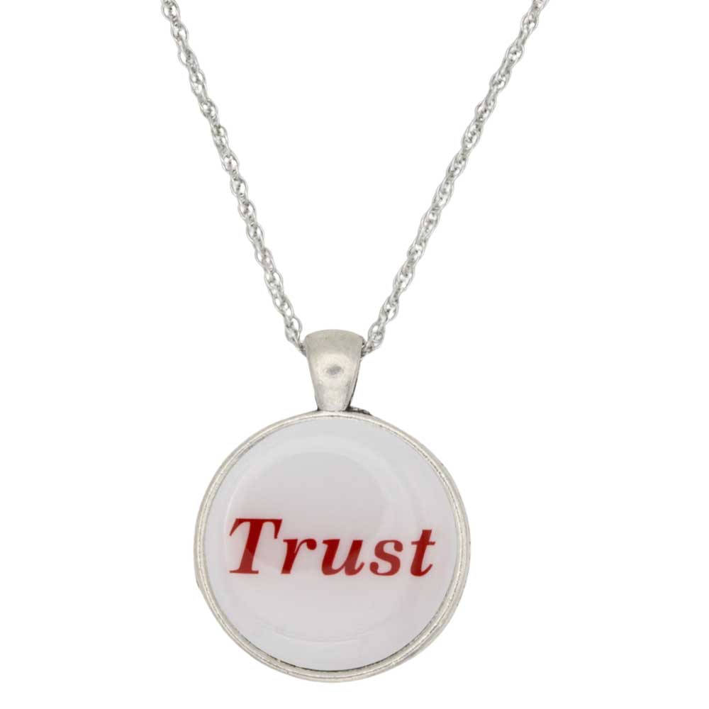 A silver chain necklace with a round pendant featuring a white face with the word 'Trust' printed in red serif text, shown against a plain white background - Lilylin Designs