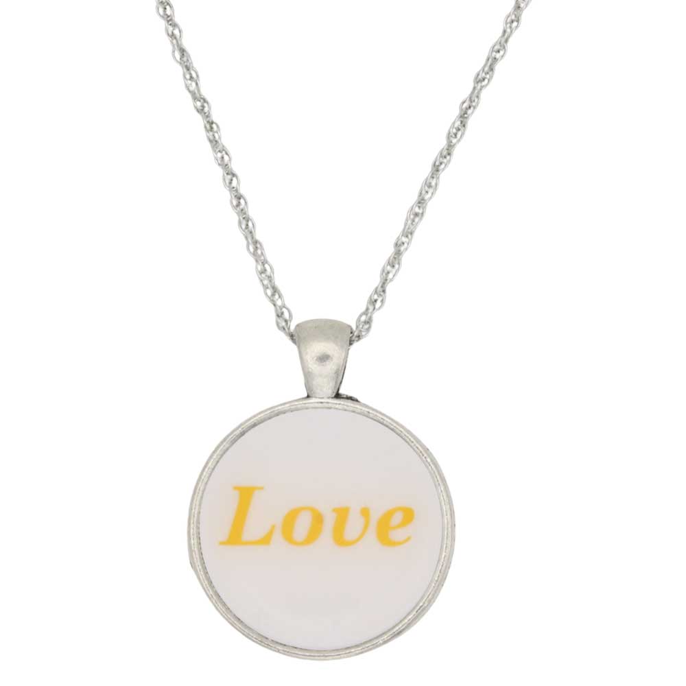 A silver chain necklace with a round pendant featuring the word 'Love' printed in yellow text on a white background, shown against a plain white backdrop - Lilylin Designs