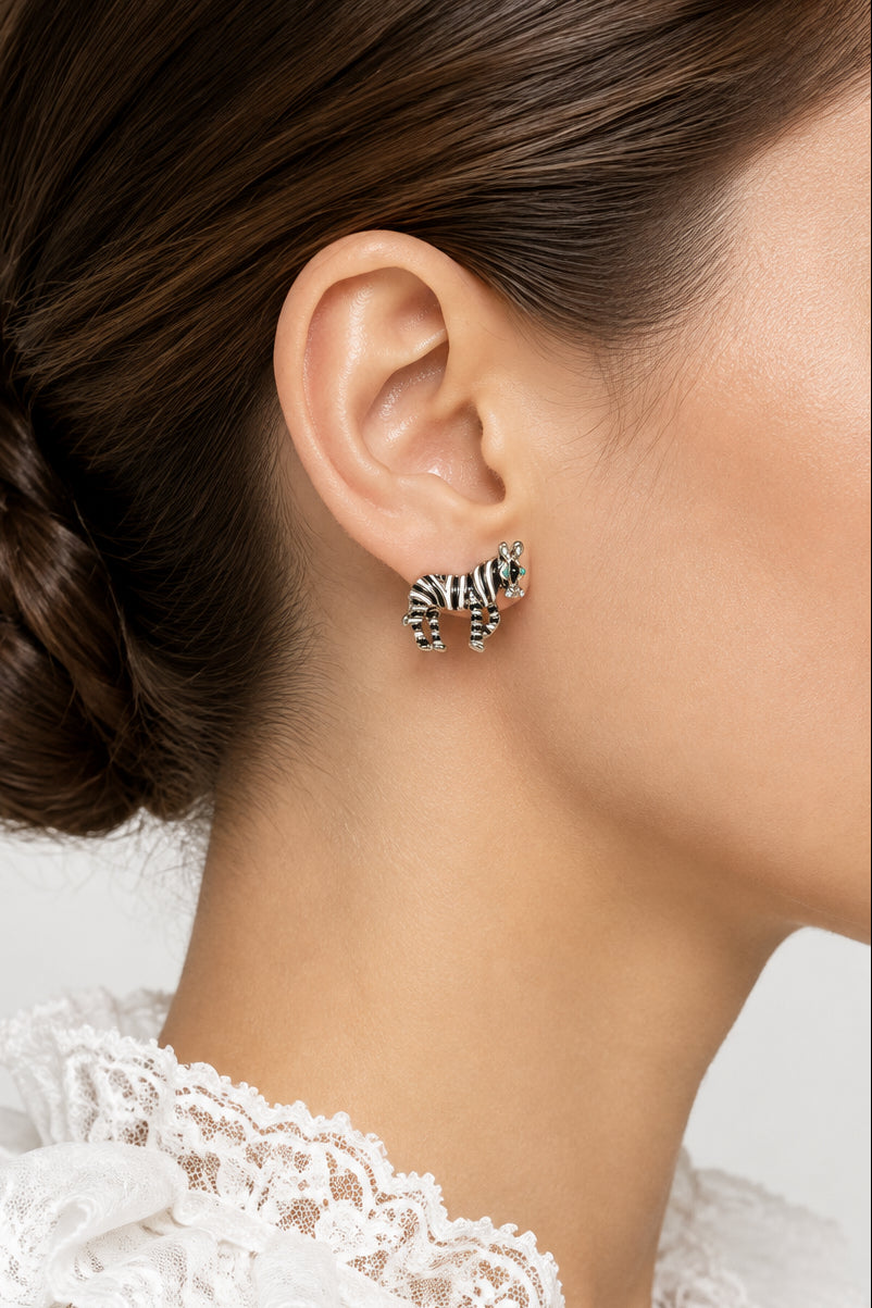 Model wearing black and white enamel zebra pierced earring - Lilylin Designs