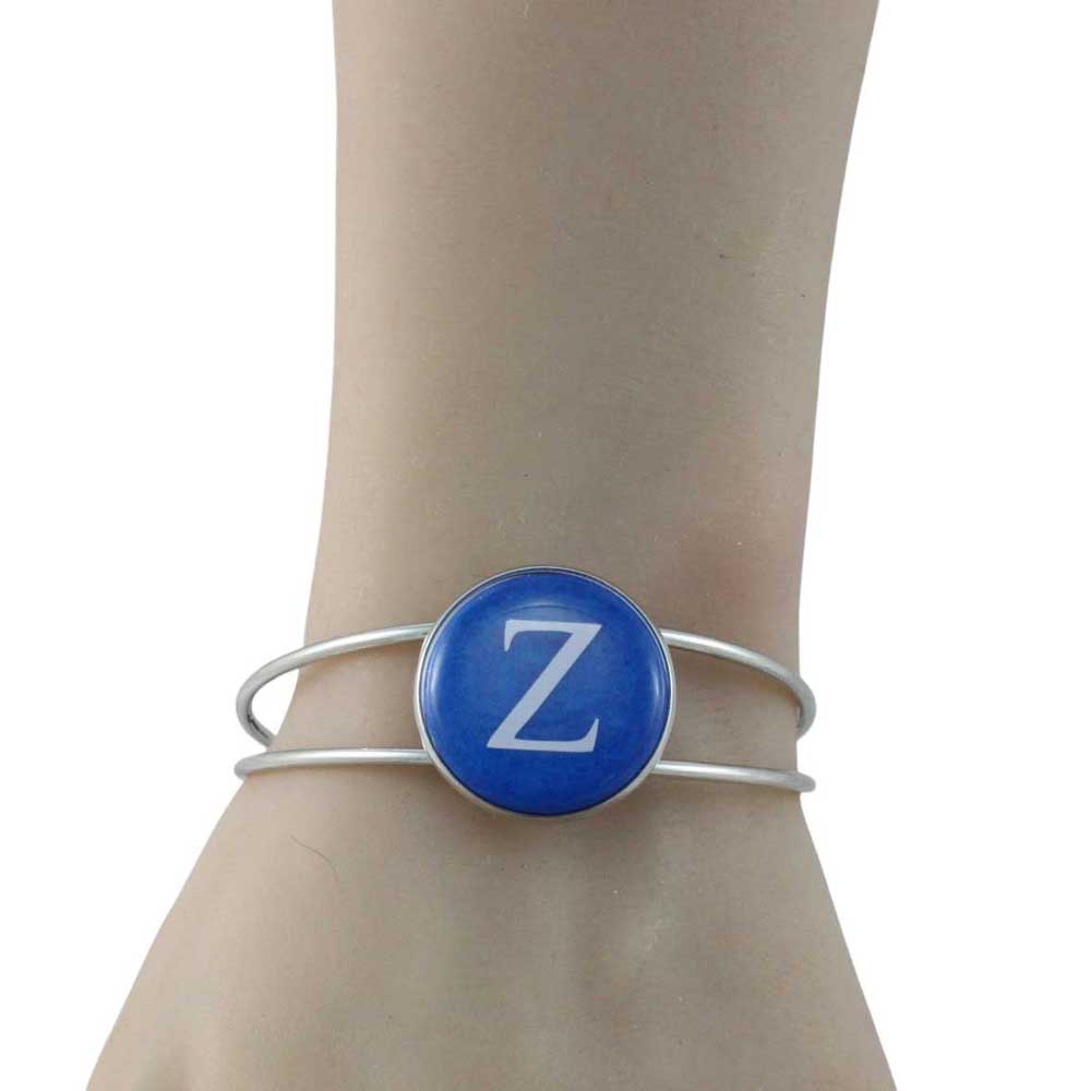 Bracelet with a blue disc featuring the letter 'Z' on a mannequin arm - Lilylin Designs