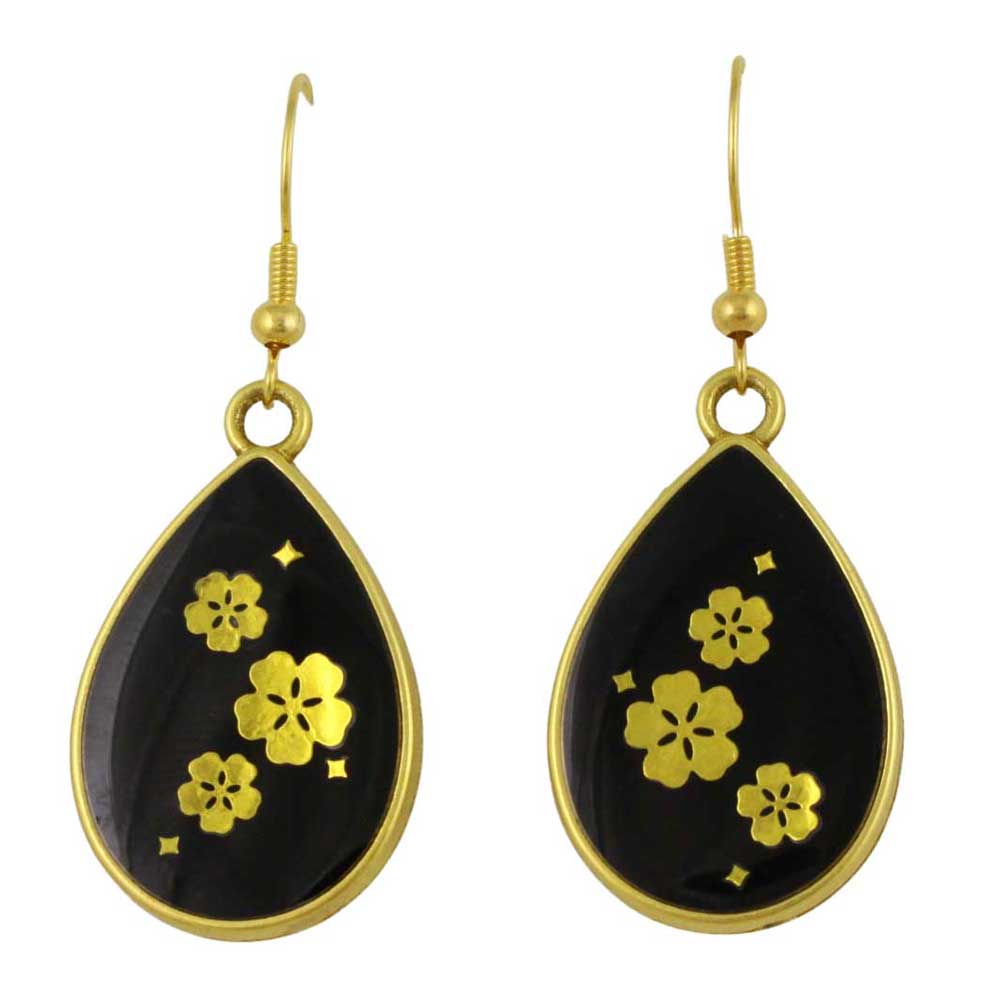 Black teardrop earrings with gold floral designs on a white background