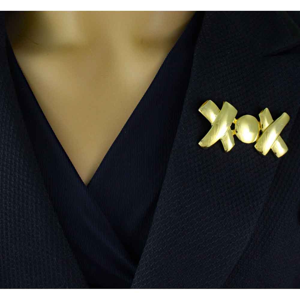 Model wearing gold-plated XOX Hugs and Kisses Brooch Pin - Lilylin Designs